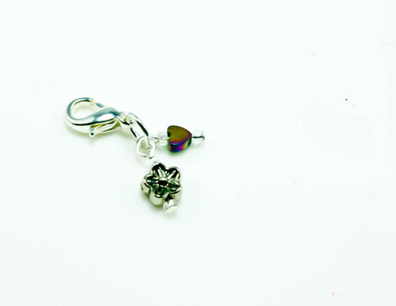 flower charm with red birthstone