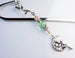 green beaded fairy charm on silver bookmark